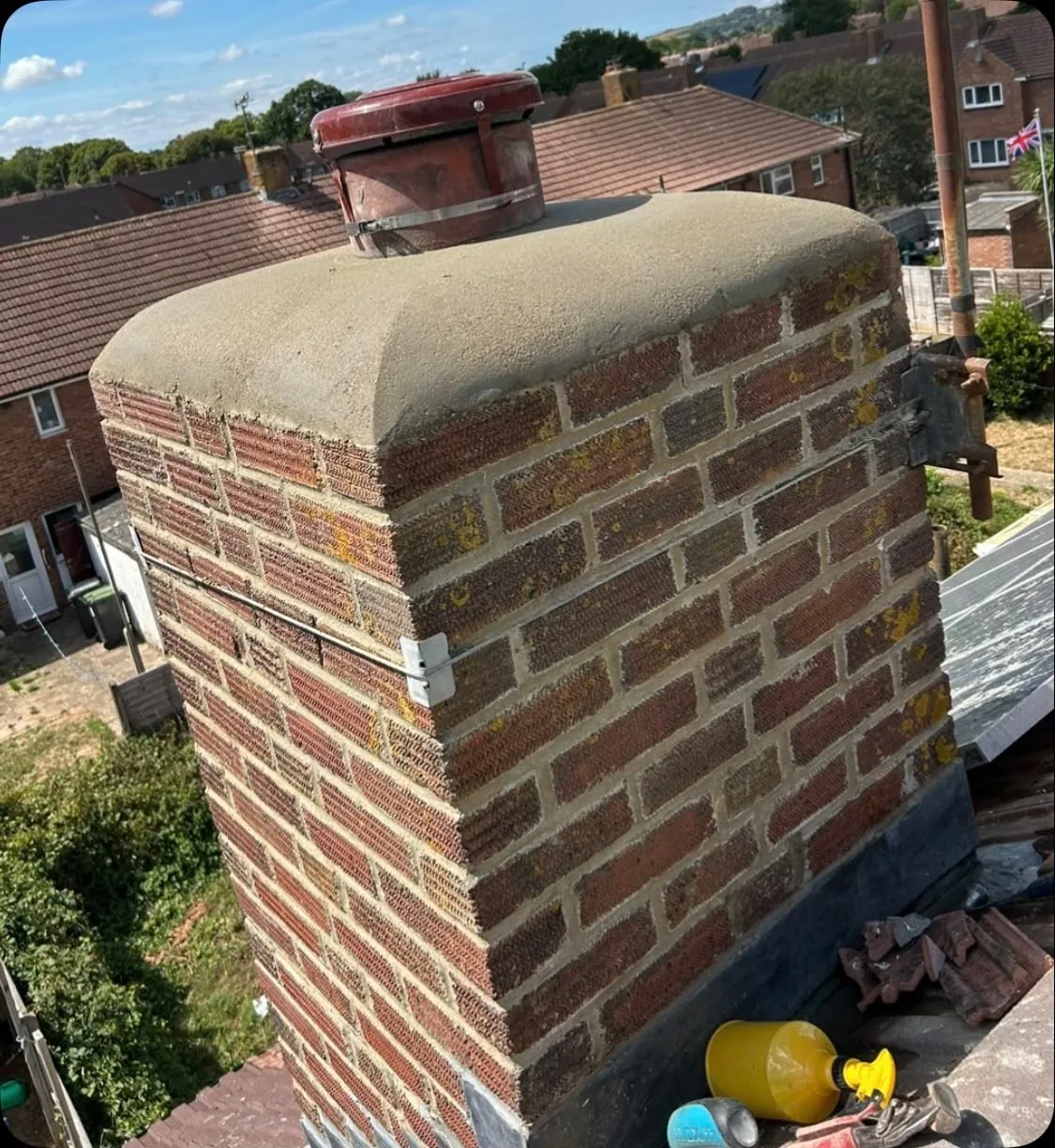 Finished chimney repair with a new cowl and replacement leadwork
