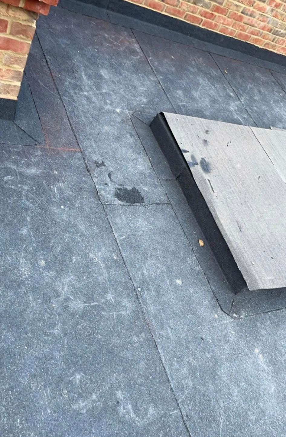 Completed felt flat roof with clean upstands and perimeter drip trims, Hampshire (after)