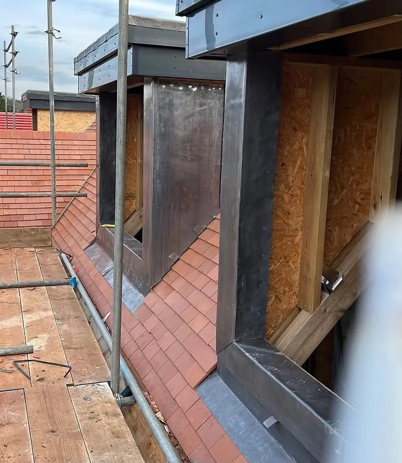 Hand-dressed lead cladding on a dormer window