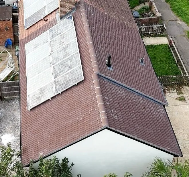 Drone roof survey photograph of a tiled roof with solar panels