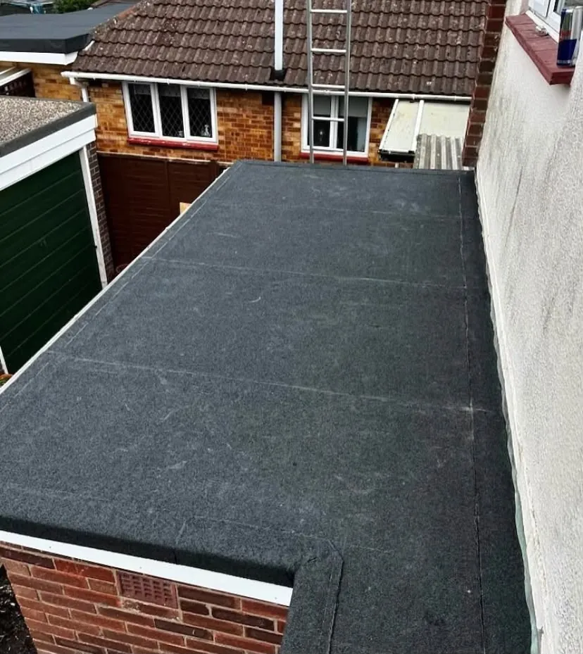 Finished flat roof covering with clean upstands on a house extension