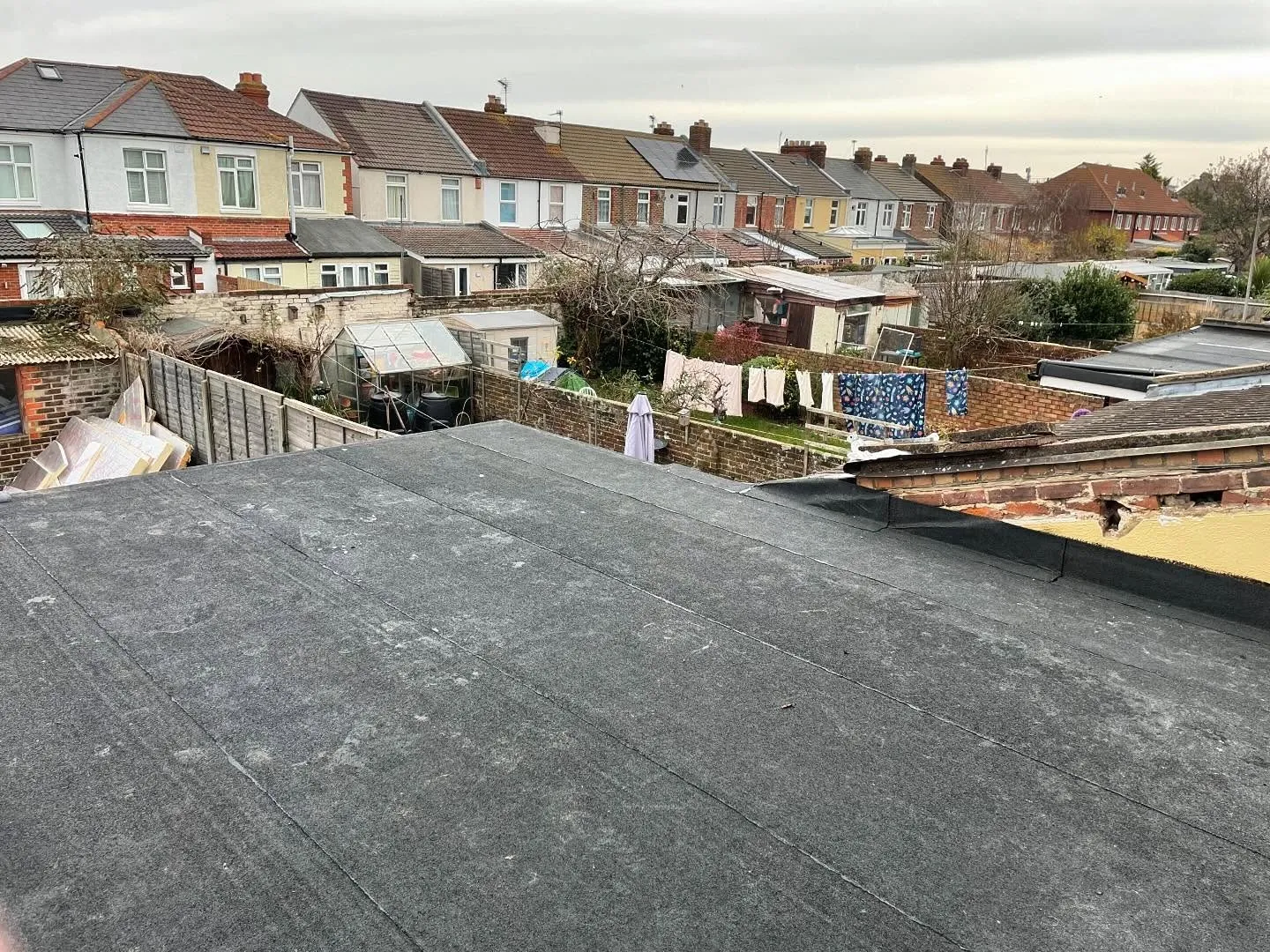 Completed felt flat roof with clean upstands and perimeter drip trims, Hampshire (after)